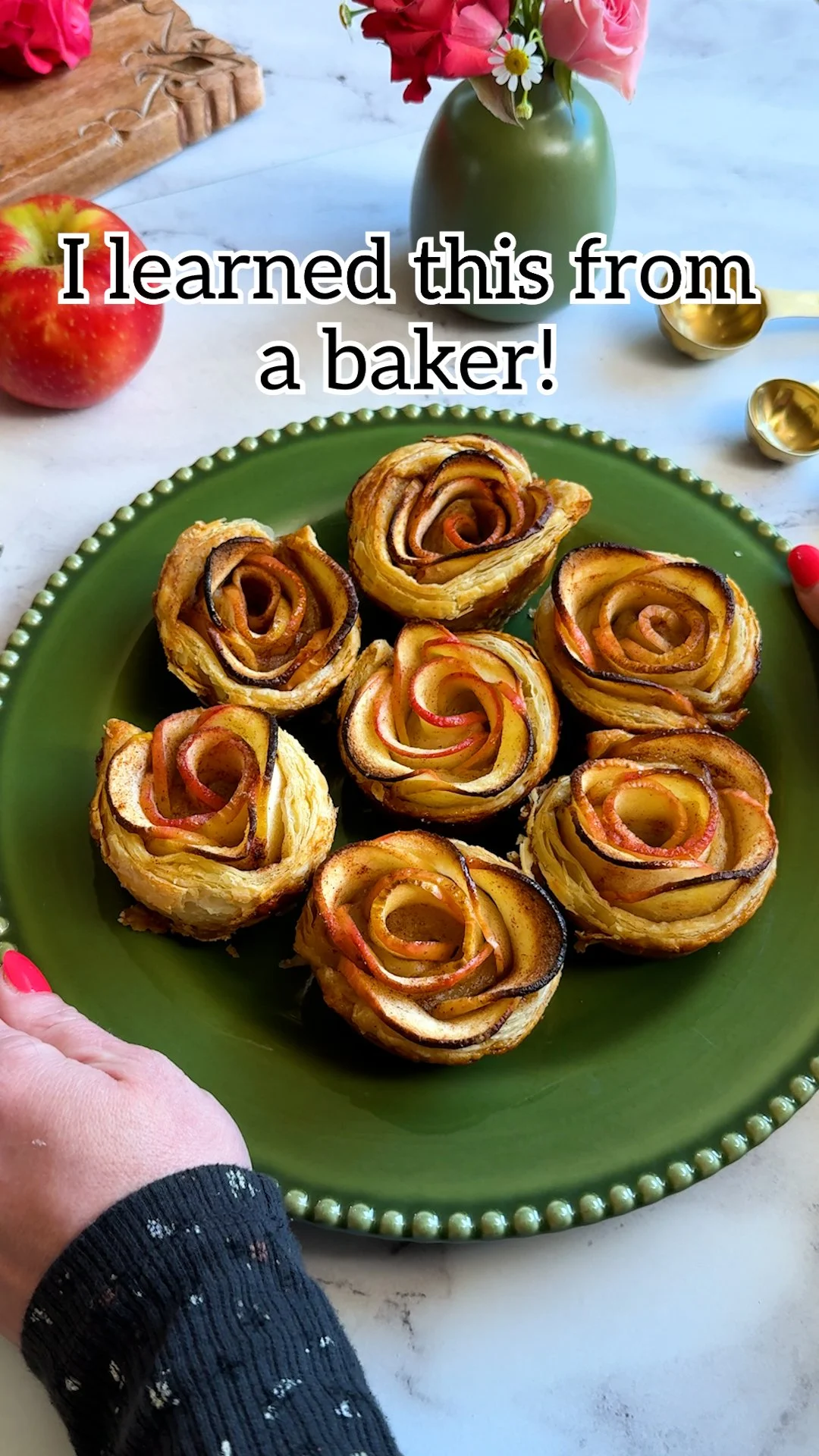 Delicious apple rose tarts decorated with fresh apples and pastry, perfect for dessert.