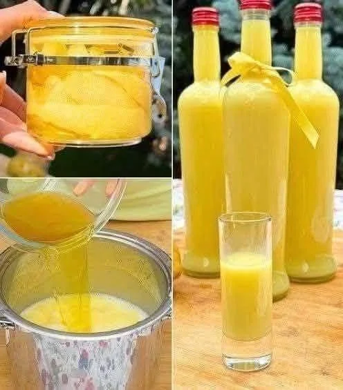 A refreshing glass of ginger water with slices of fresh ginger and lemon on a wooden table.