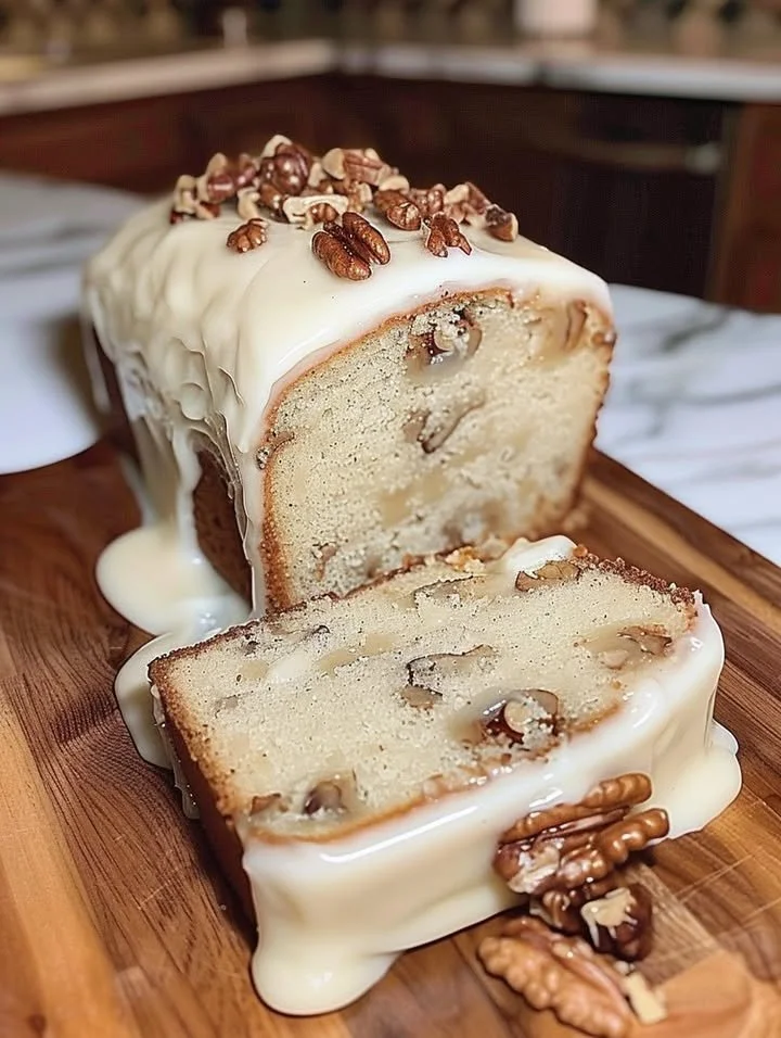 Keto Butter Pecan Cake with pecans and creamy frosting on a plate