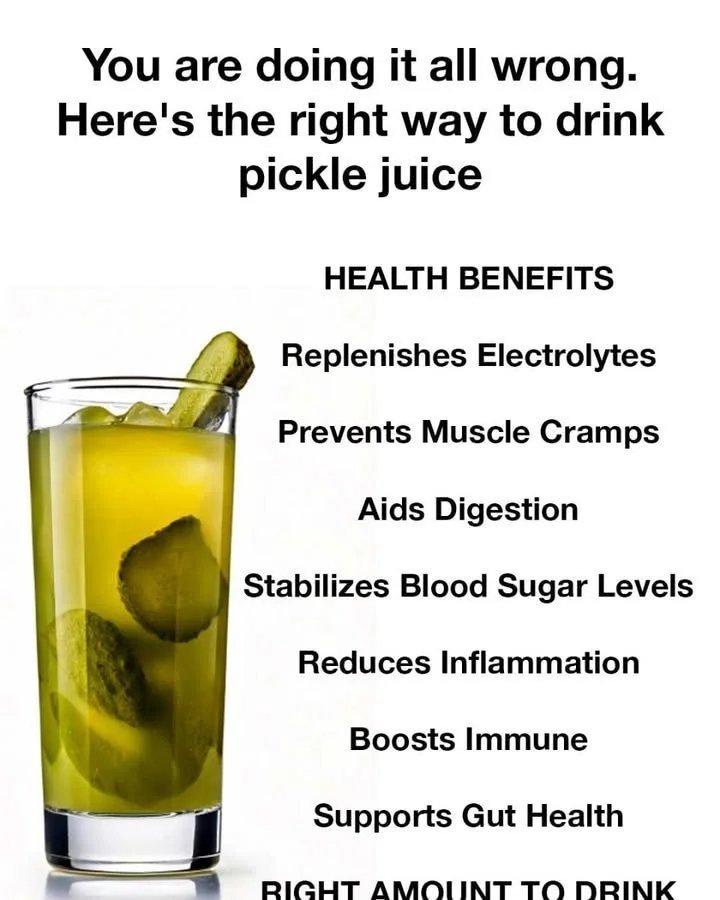 A glass of pickle juice with cucumbers and spices for hydration and health benefits.