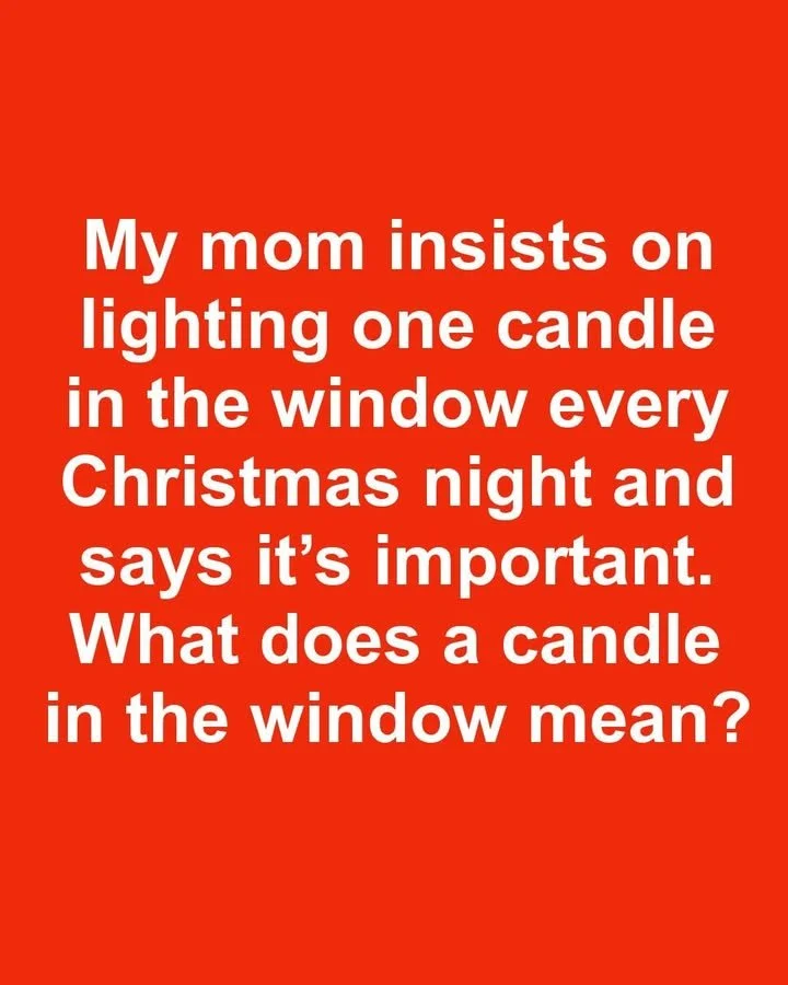 Candle in the window symbolizing Christmas traditions.