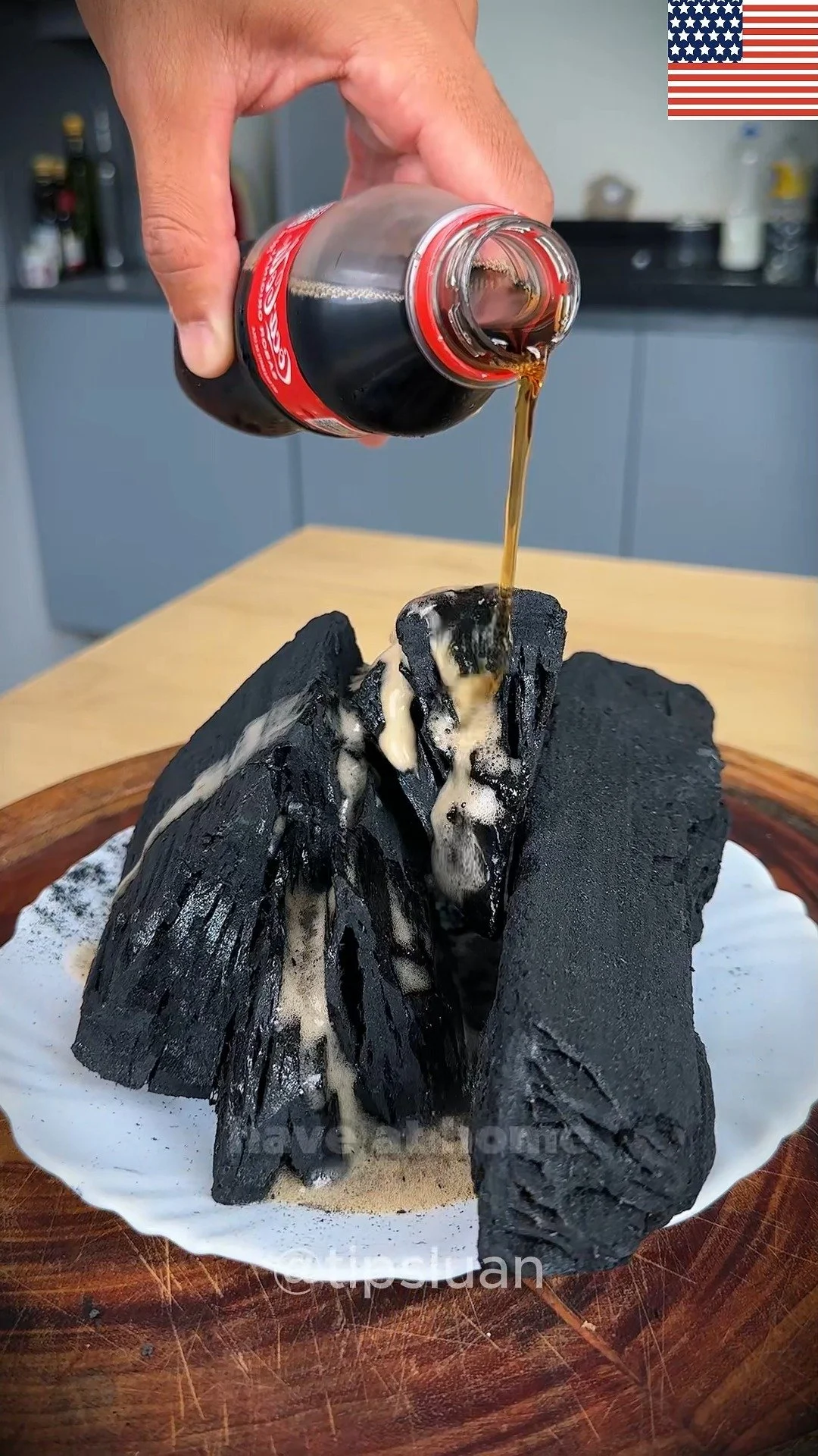 Coca-Cola poured on charcoal, illustrating a unique chemical reaction.