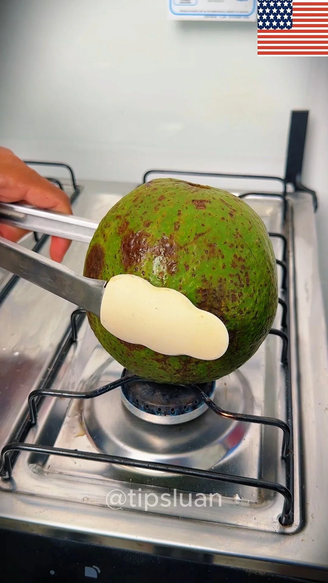 Cooked avocado on a stove, showcasing its unique texture and flavor.