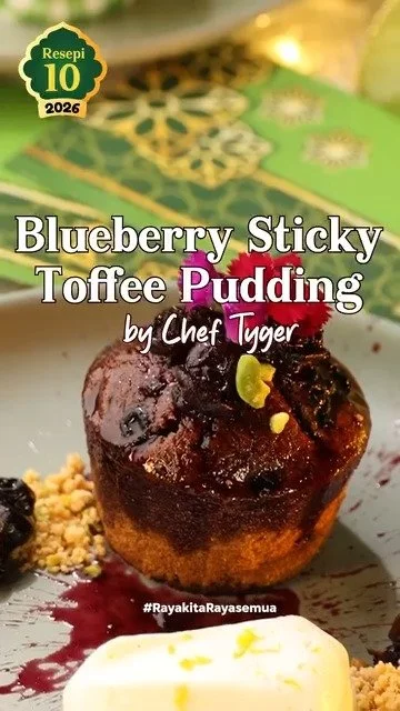 Delicious blueberry toffee pudding dessert topped with berries and toffee sauce.