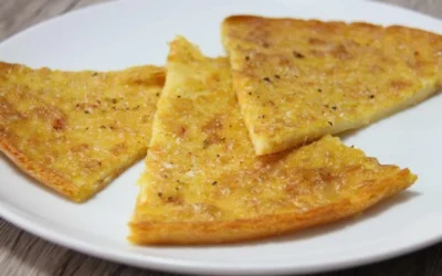Delicious homemade chickpea farinata served with fresh herbs.