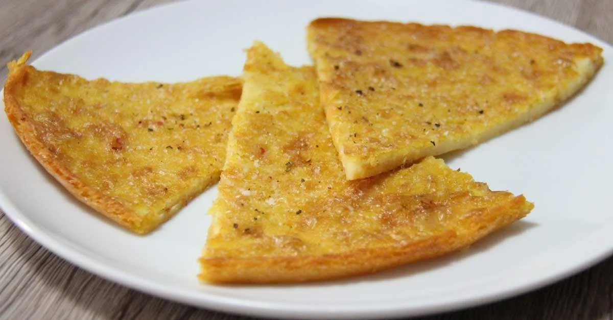Delicious homemade chickpea farinata served with fresh herbs.