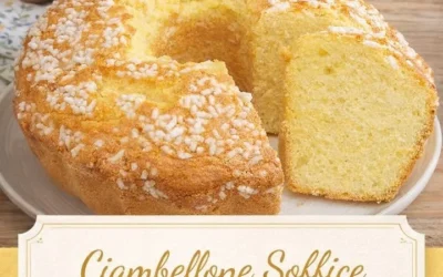 Deliciously fluffy Ciambellone cake served on a plate with a slice cut out.