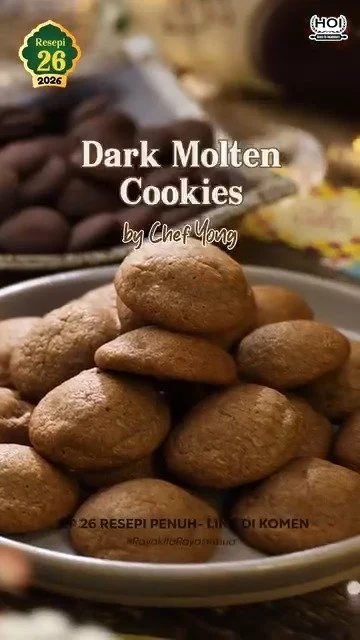 Dark molten cookies with gooey chocolate center, fresh out of the oven