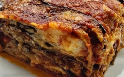 Homemade Eggplant Parmesan served on a plate with melted cheese and marinara sauce