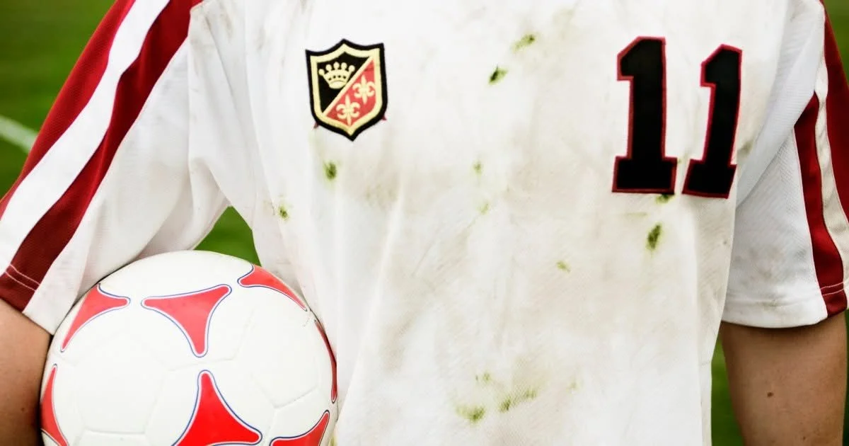 Soccer jersey with pit stains being cleaned for the World Cup