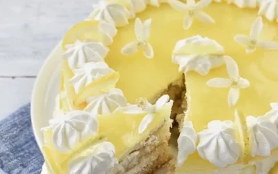 Fresh lemon slice on a wooden cutting board for culinary use.