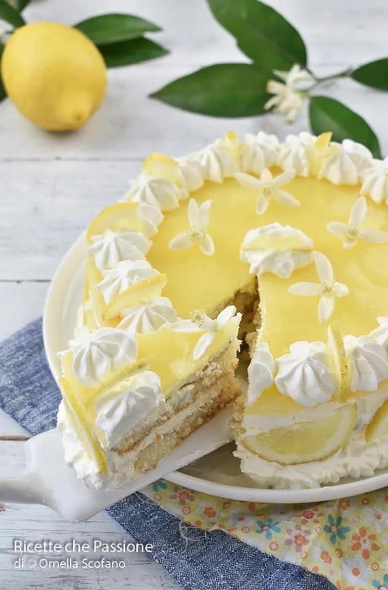 Fresh lemon slice on a wooden cutting board for culinary use.