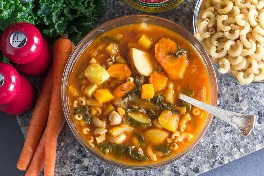 Bowl of Low FODMAP Vegetable Soup with pasta and beans