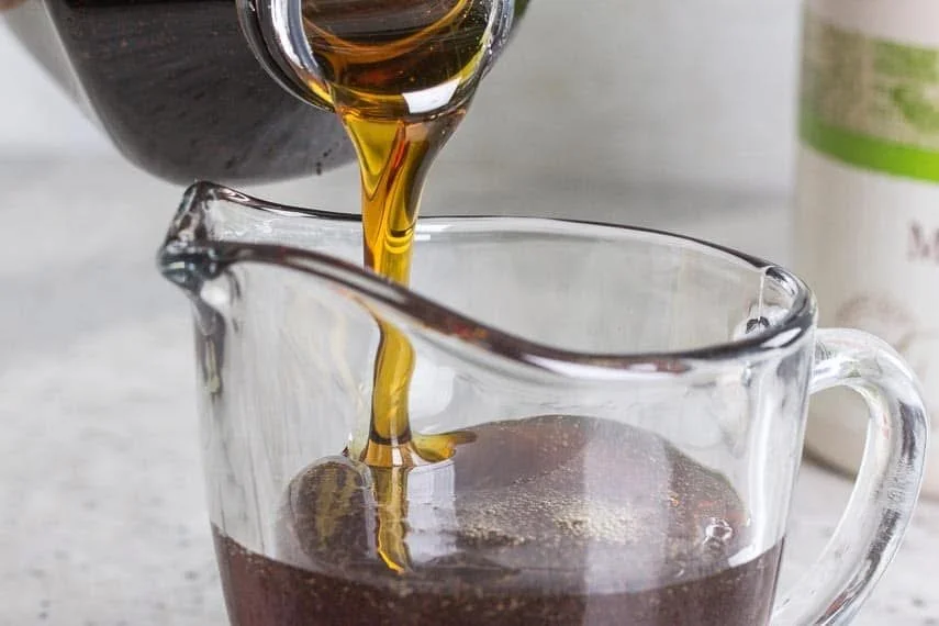 Maple syrup bottle with FODMAPs label highlighting new findings
