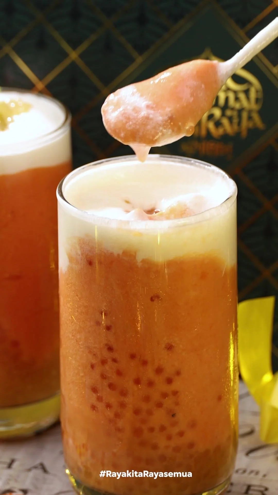 Delicious papaya milkshake topped with fresh fruit and cream