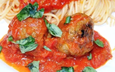 Delicious Sicilian-style meatballs served on a plate with sauce