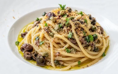 Plate of spaghetti with sautéed eggplant and herbs