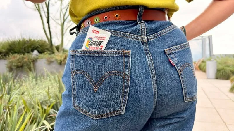 Person wearing the same jeans daily to save water and promote sustainability