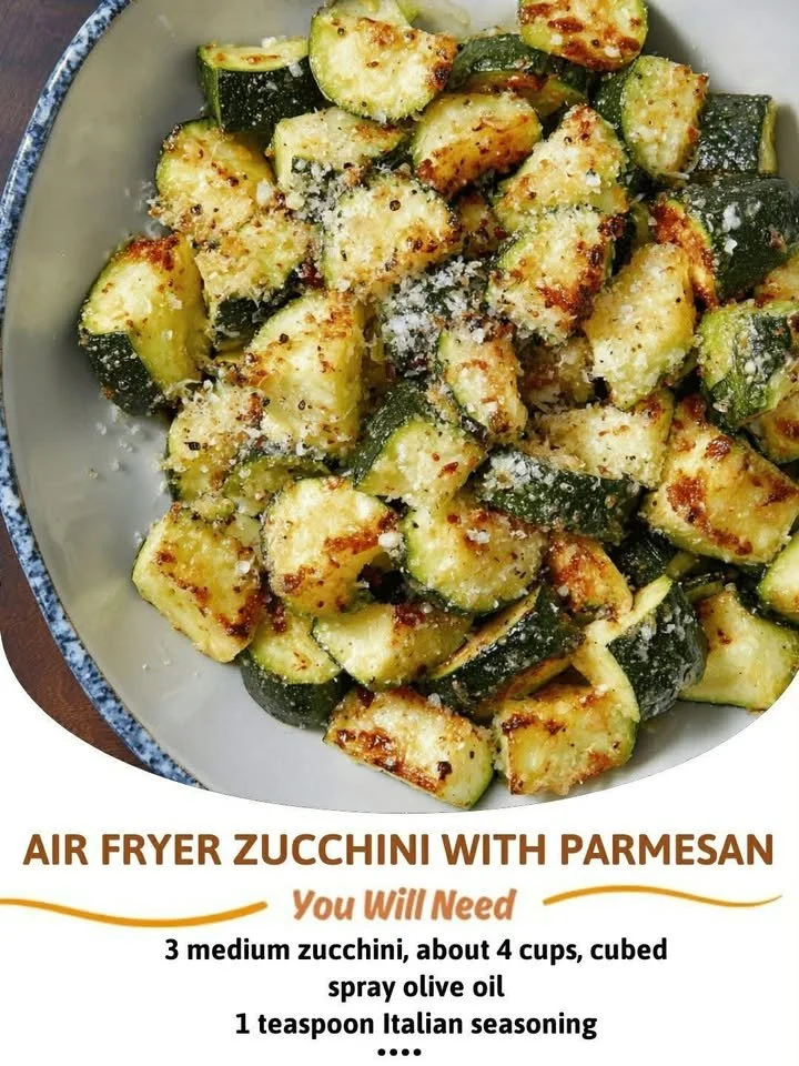 Air Fryer Parmesan Zucchini slices topped with cheese and herbs