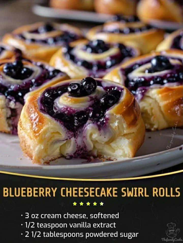 Blueberry cheesecake swirl rolls on a plate with fresh blueberries