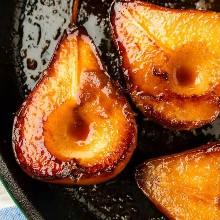Delicious caramelized pears served on a dessert plate.