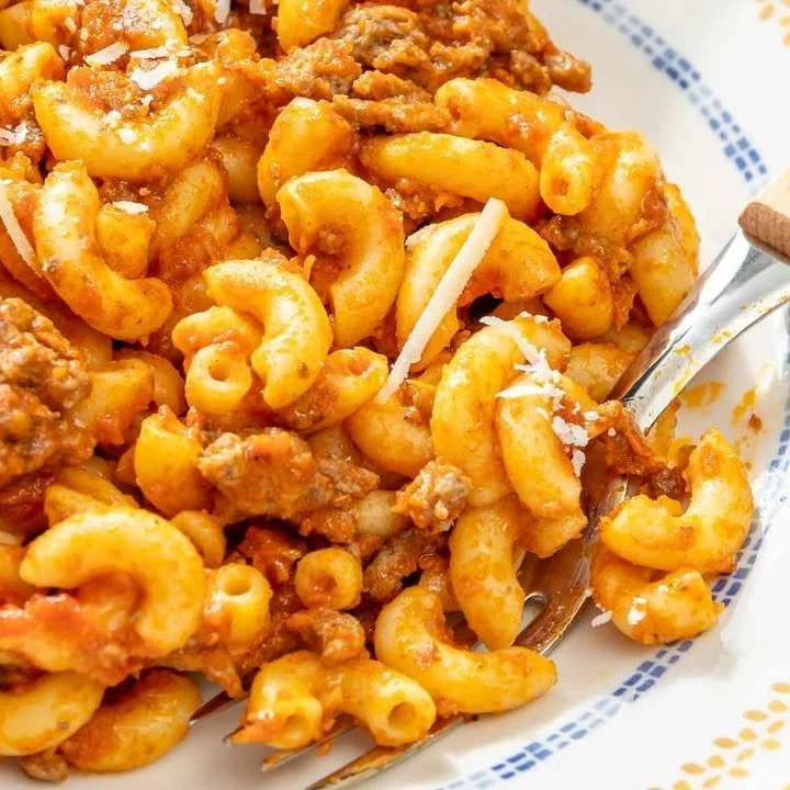 Delicious Johnny Mac Casserole served in a dish with melted cheese on top.