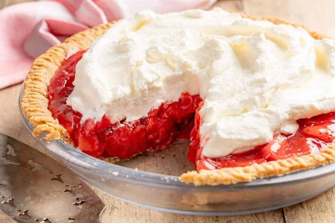 No-bake fresh strawberry pie topped with whipped cream and fresh strawberries