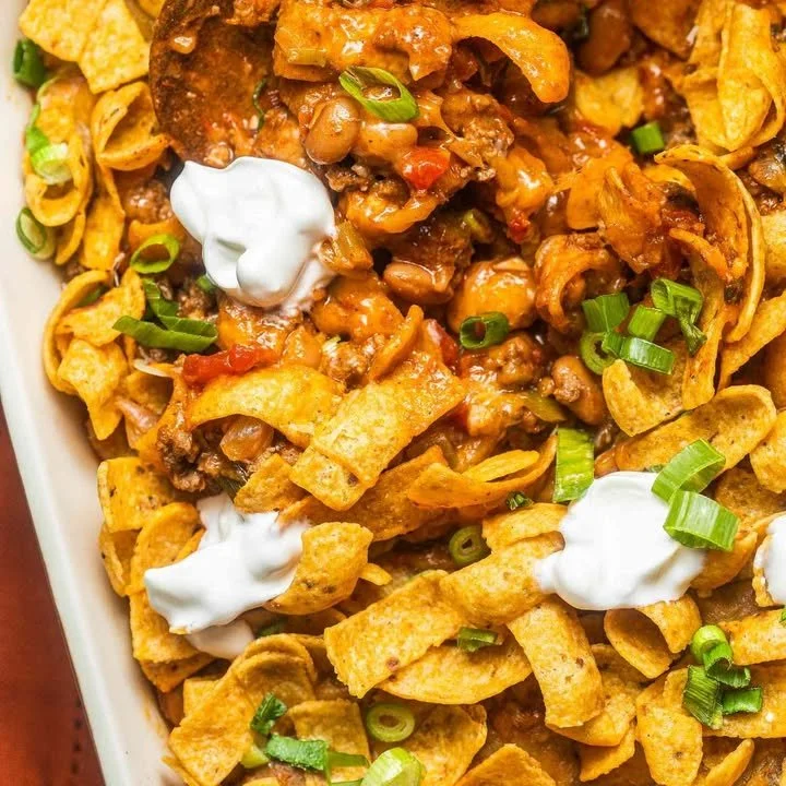 Delicious Walking Taco Casserole served in a bowl with toppings.